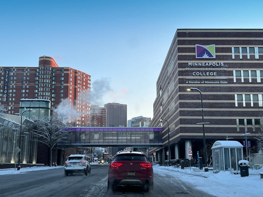car driving through downtown Minneapolis - Auto Insurance Minneapolis MN